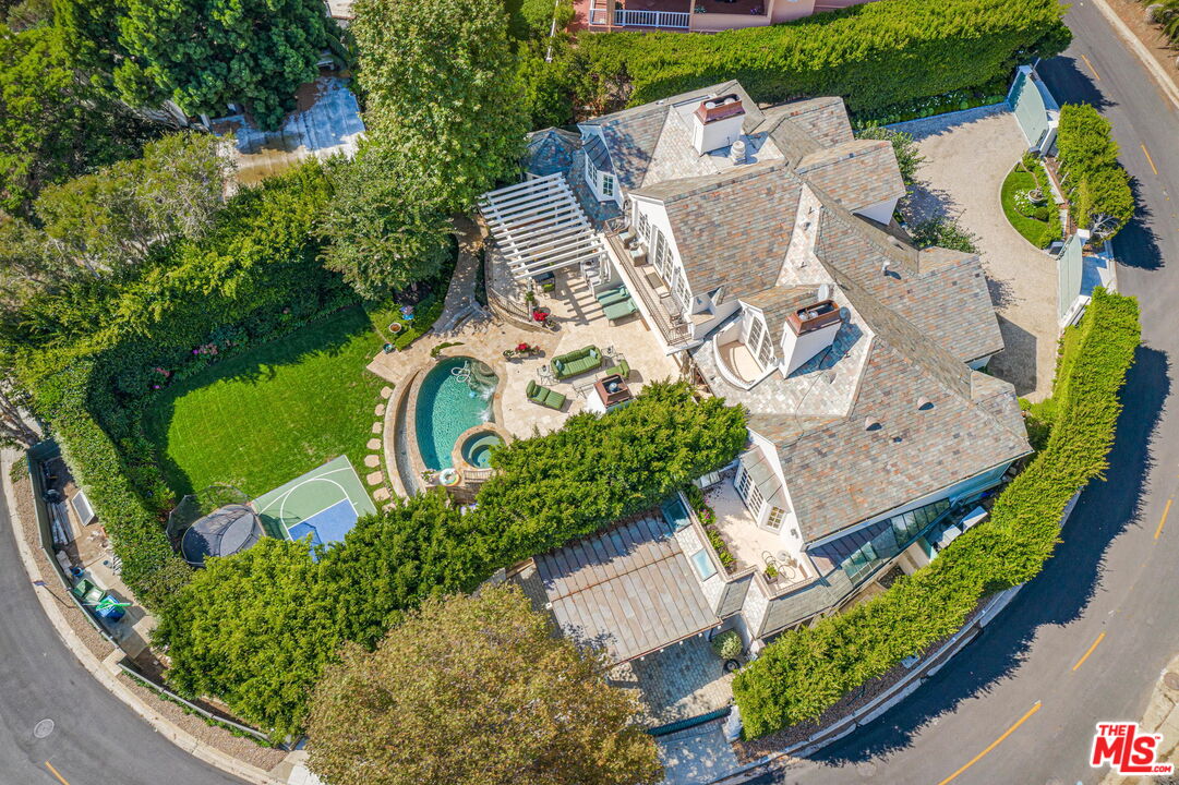 541 Paseo Miramar Pacific Palisades, CA 90272 - Photo 45 of 50 an aerial view of a house with a garden and plants