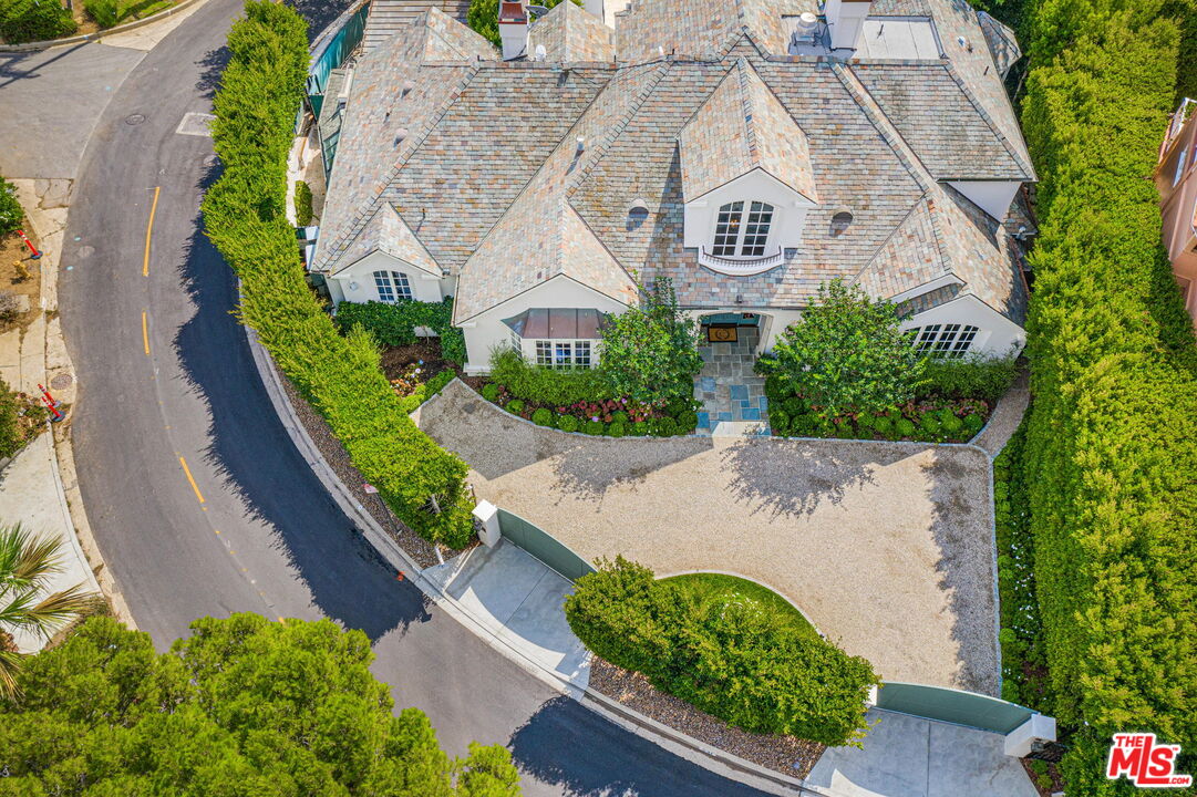 541 Paseo Miramar Pacific Palisades, CA 90272 - Photo 48 of 50 a view of a house with a yard and lake