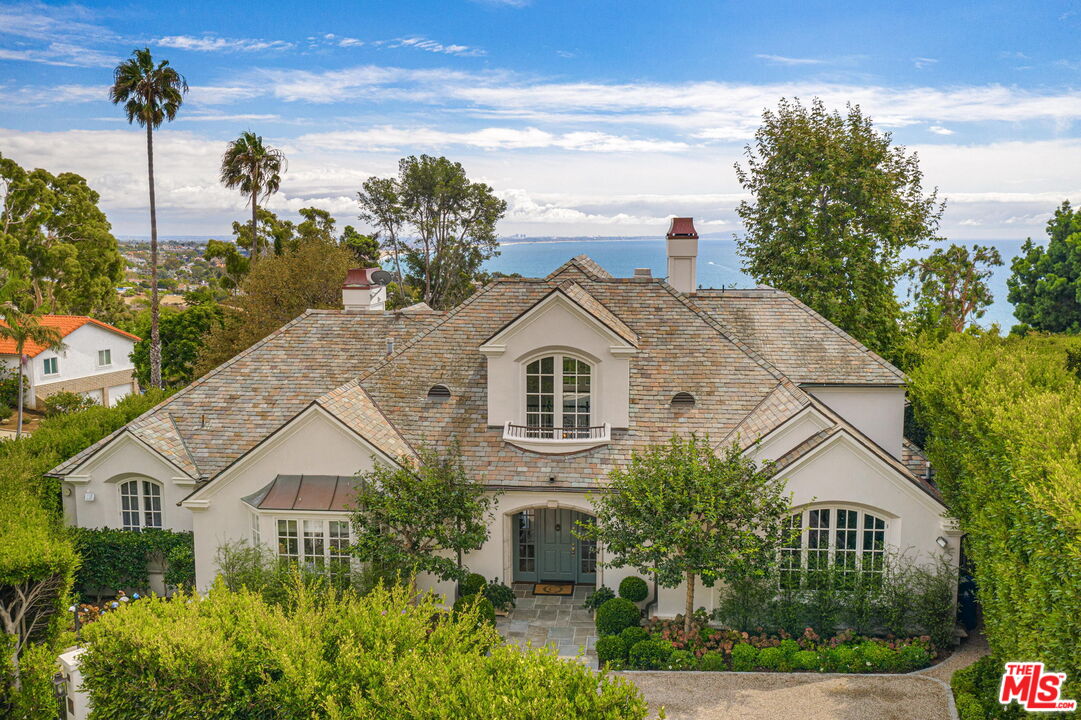 541 Paseo Miramar Pacific Palisades, CA 90272 - Photo 50 of 50 a view of a white house with a yard and plants