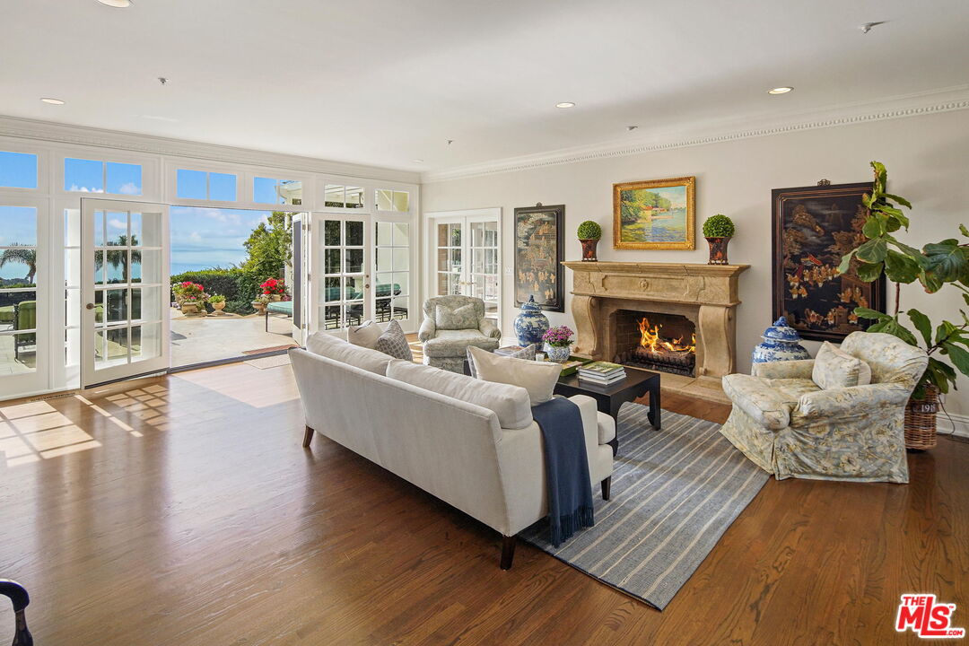 541 Paseo Miramar Pacific Palisades, CA 90272 - Photo 8 of 50 a living room with furniture and a fireplace