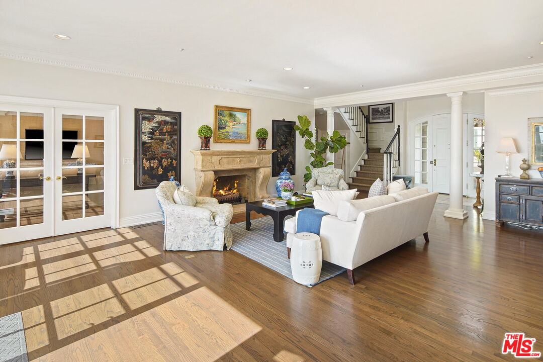 541 Paseo Miramar Pacific Palisades, CA 90272 - Photo 9 of 50 a living room with furniture and a fireplace