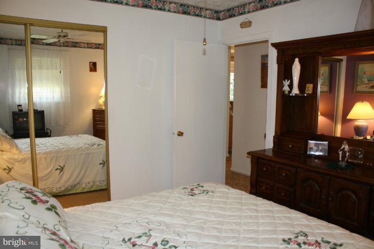 3711 Red Grove Road Baltimore, MD 21220 - Photo 19 of 24 a bedroom with a bed and a dresser