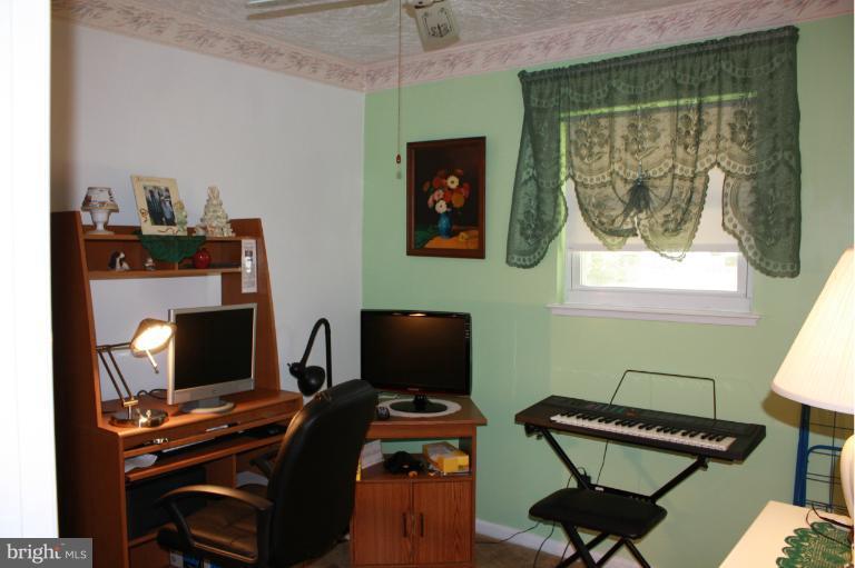 3711 Red Grove Road Baltimore, MD 21220 - Photo 3 of 24 a room with furniture and a window