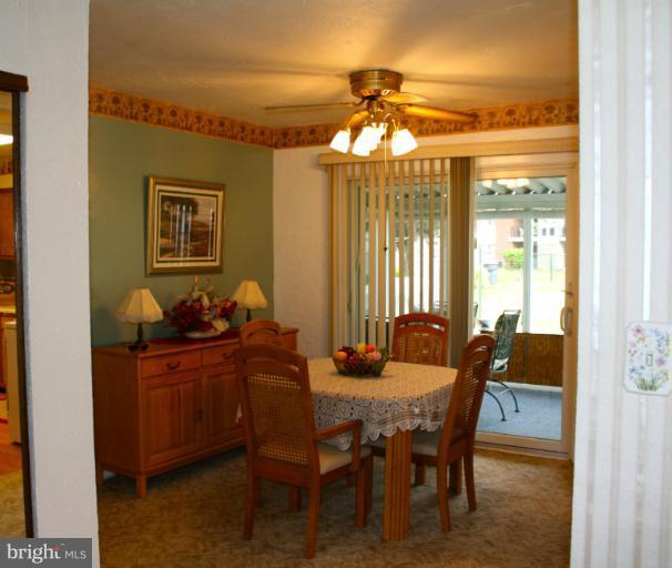 3711 Red Grove Road Baltimore, MD 21220 - Photo 22 of 24 a dining room with furniture and chandelier kitchen view