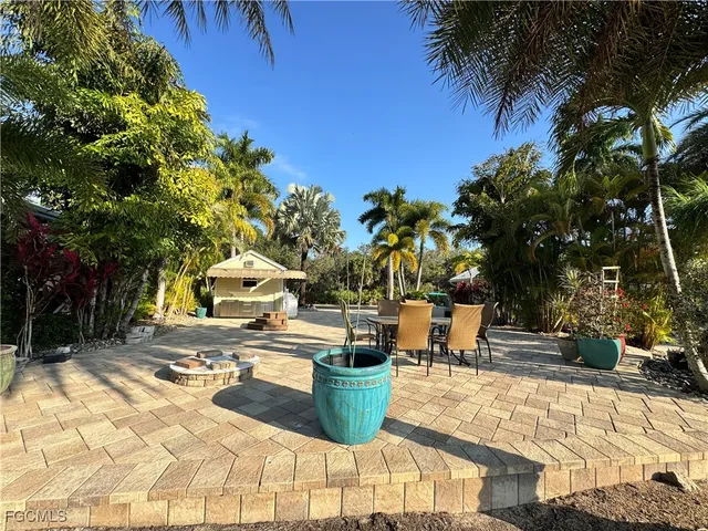 a view of a chairs and table in the patio
