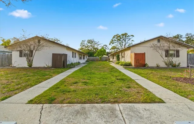 a view of a house with a yard