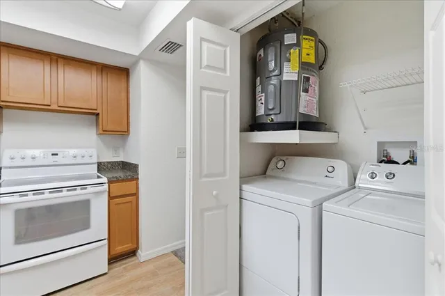 a utility room with dryer and washer