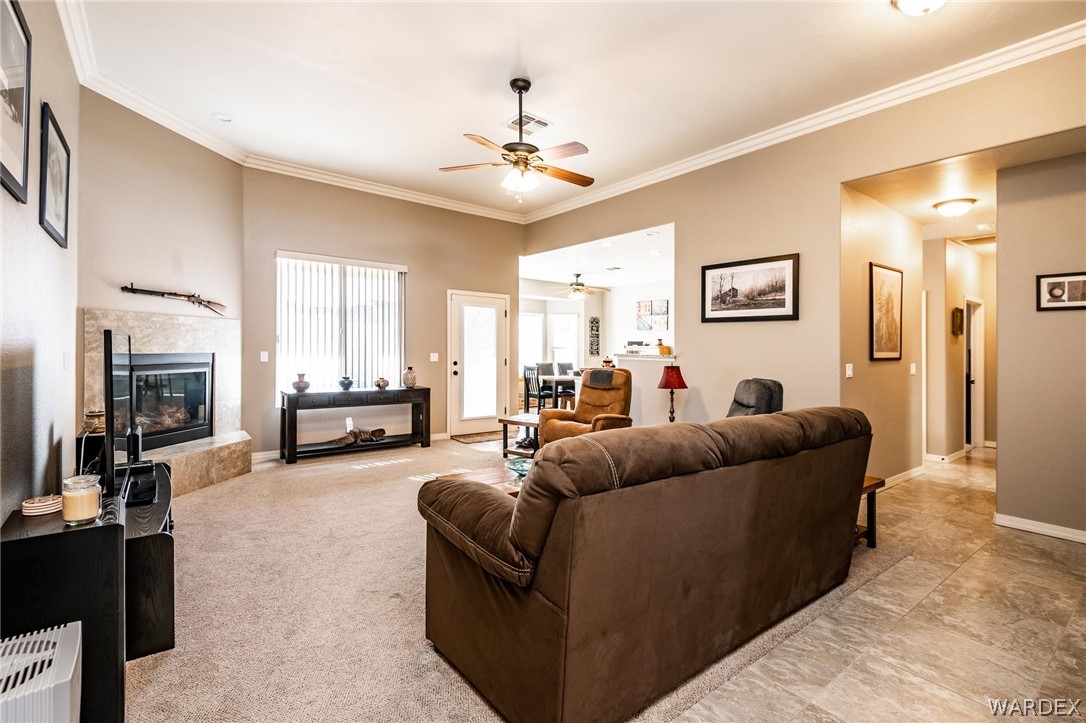 4870 North Old W Road Kingman, AZ 86401 - Photo 11 of 41 a living room with furniture and a chandelier