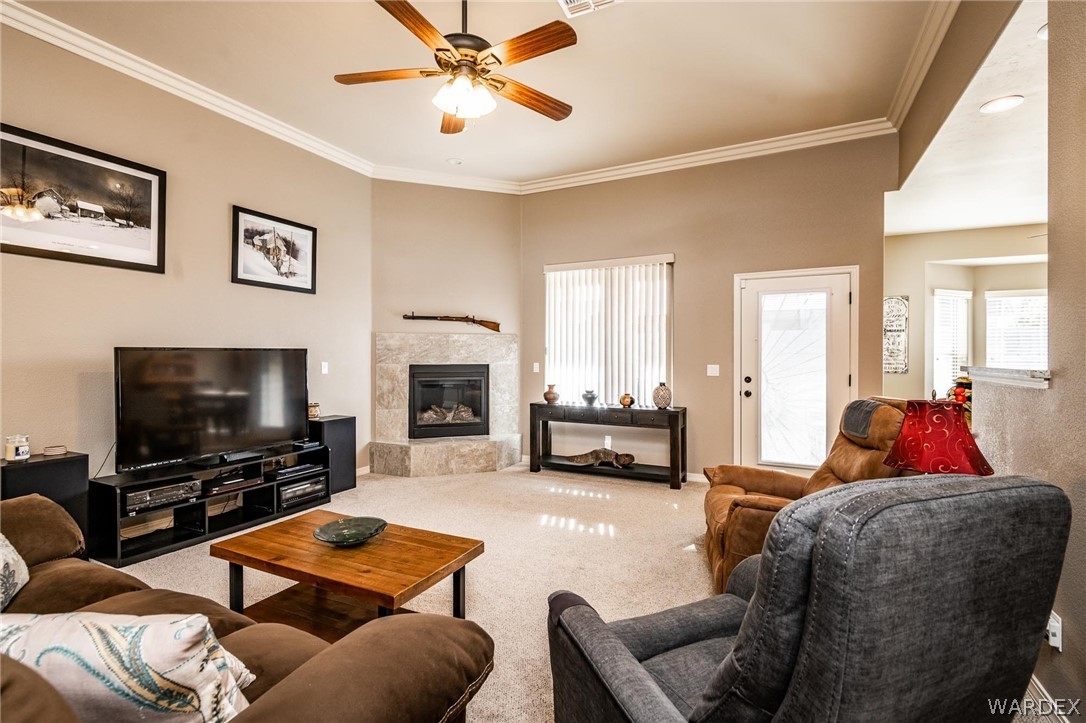 4870 North Old W Road Kingman, AZ 86401 - Photo 12 of 41 a living room with furniture and a flat screen tv with wooden floor
