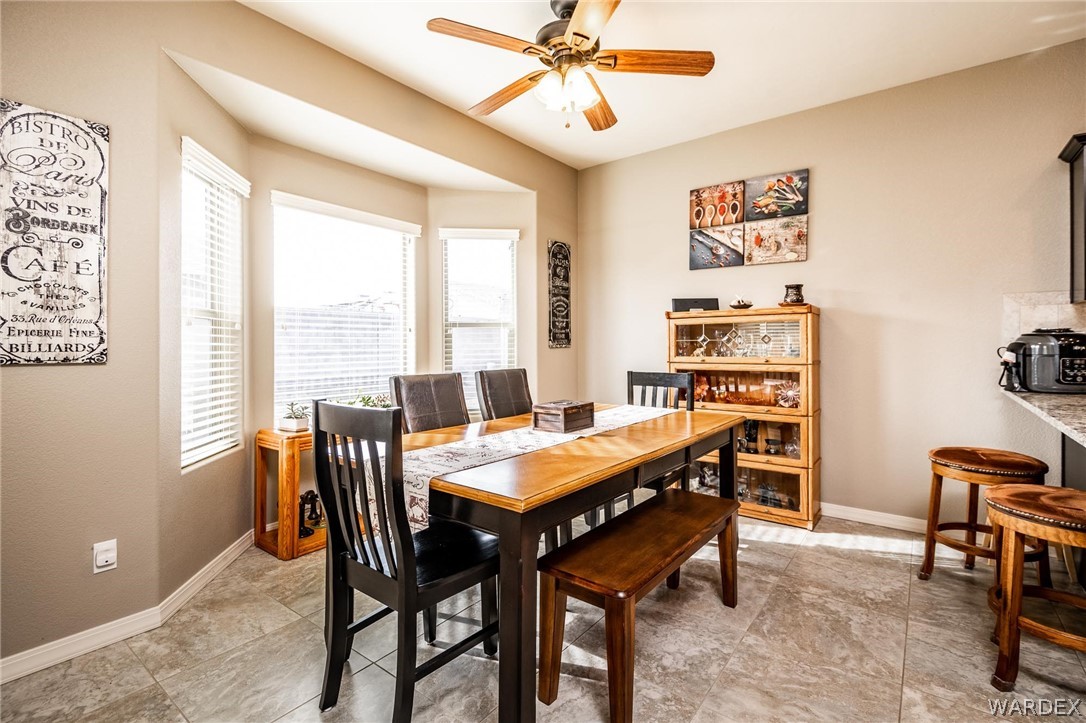 4870 North Old W Road Kingman, AZ 86401 - Photo 14 of 41 a view of a dining room with furniture and a window