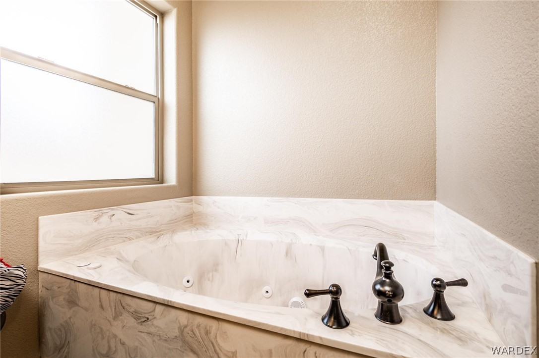 4870 North Old W Road Kingman, AZ 86401 - Photo 24 of 41 a bathroom with a sink and a mirror