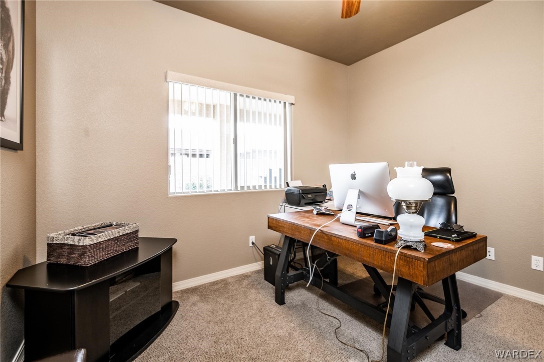 4870 North Old W Road Kingman, AZ 86401 - Photo 28 of 41 a workspace with furniture and window