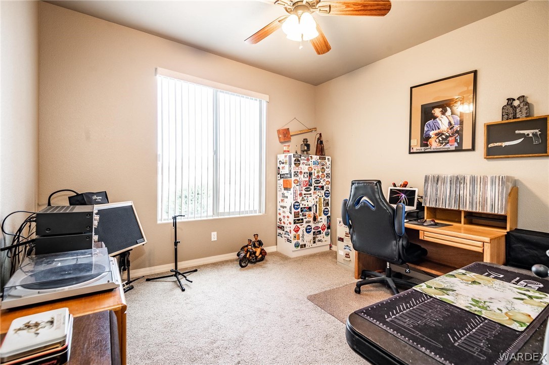 4870 North Old W Road Kingman, AZ 86401 - Photo 30 of 41 a view of a workspace with furniture and a window