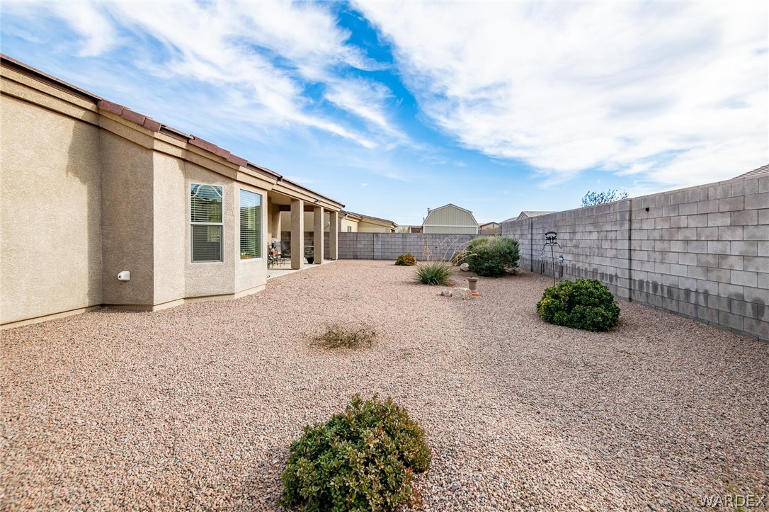 4870 North Old W Road Kingman, AZ 86401 - Photo 38 of 41 a view of a house with backyard and bushes