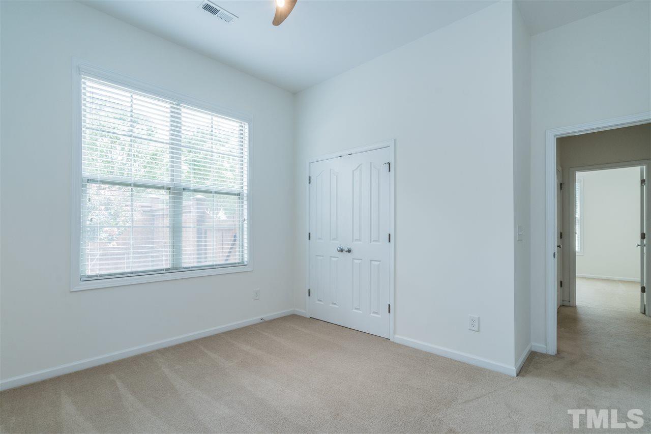 7775 Berry Crest Avenue Raleigh, NC 27617 - Photo 19 of 27 Built in cabinets in closet can be removed.
