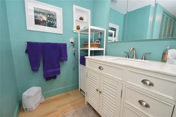 a bathroom with a sink and a mirror