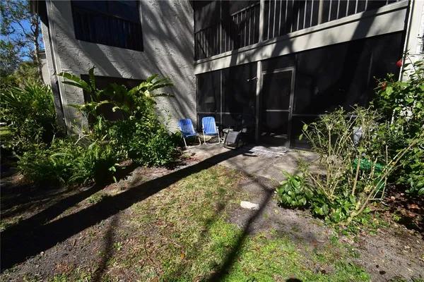 a view of path along with flowers and trees