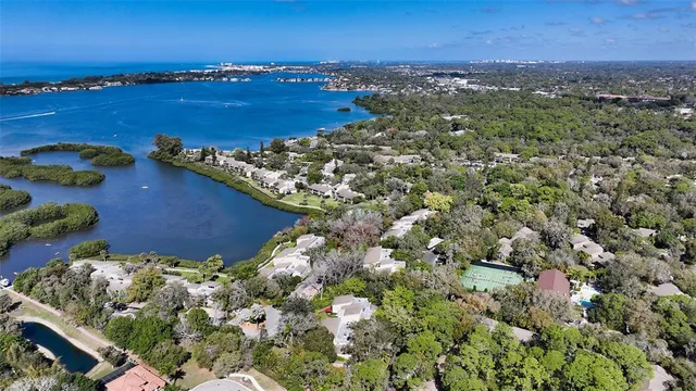 an aerial view of a residential houses with outdoor space and swimming pool