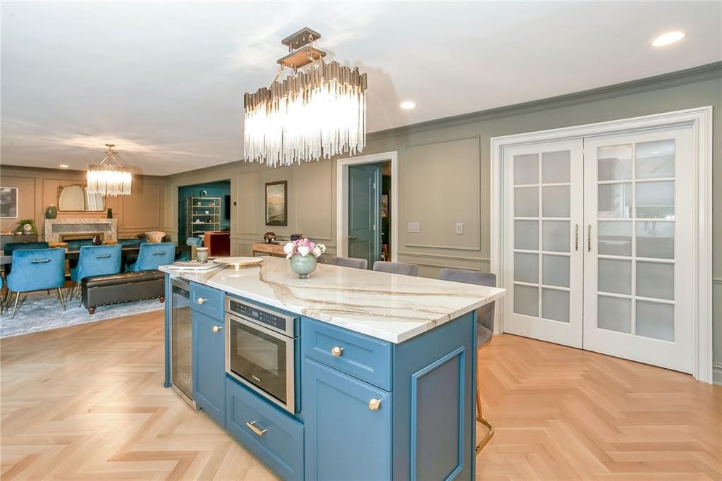 433 New Rochelle Road Bronxville, NY 10708 - Photo 12 of 41 a kitchen with a stove and a wooden floors