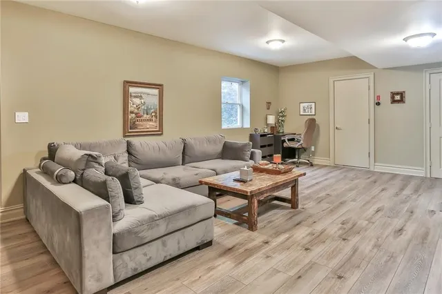 a kitchen with stainless steel appliances a refrigerator sink and microwave