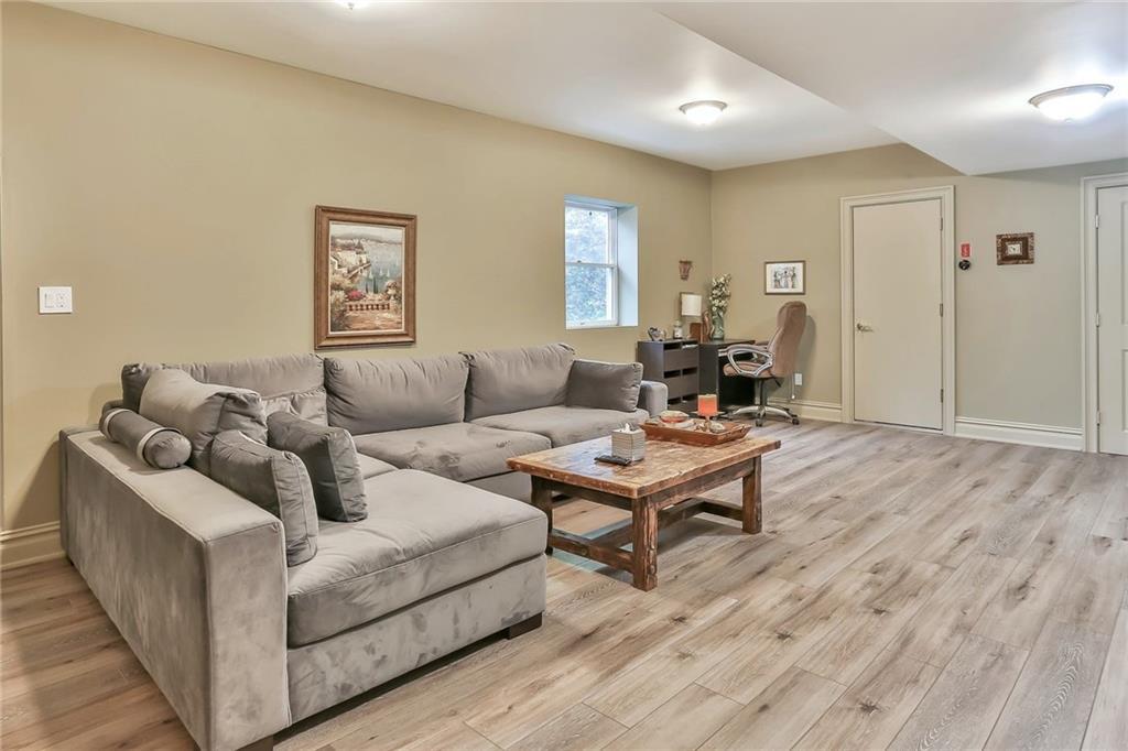 433 New Rochelle Road Bronxville, NY 10708 - Photo 26 of 41 a living room with furniture and a wooden floor