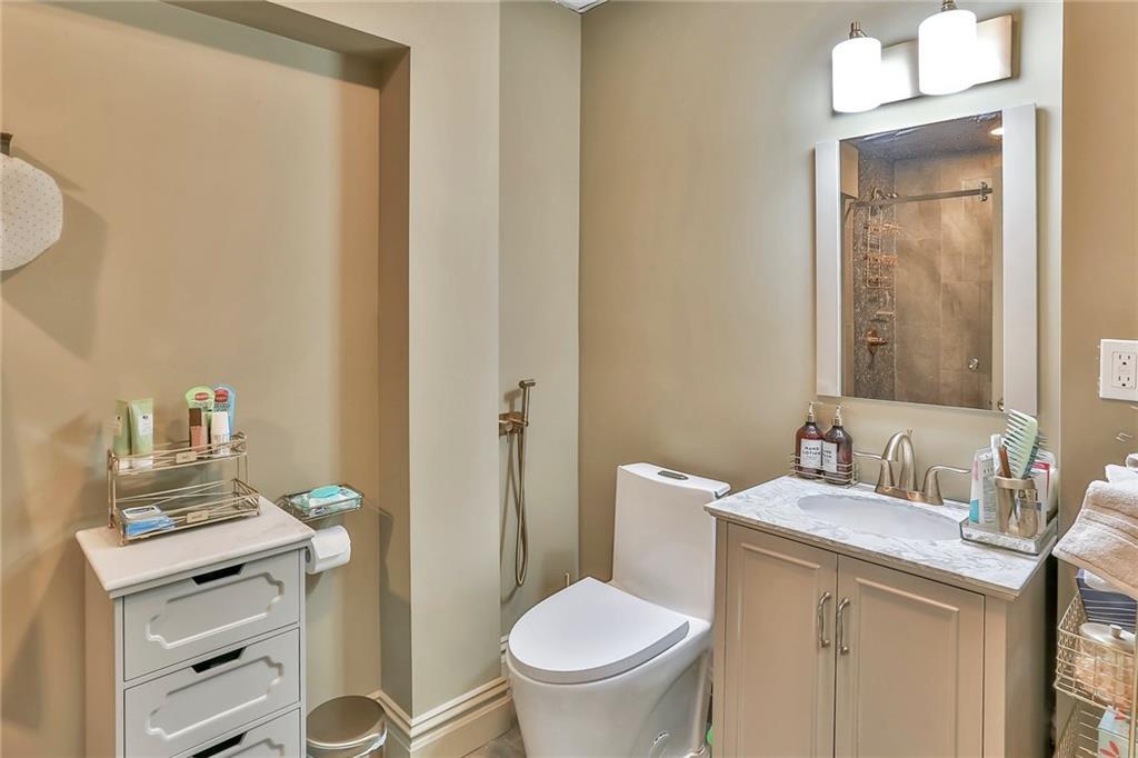 433 New Rochelle Road Bronxville, NY 10708 - Photo 29 of 41 a bathroom with a toilet sink and mirror