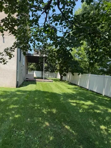 a view of a back yard of the house
