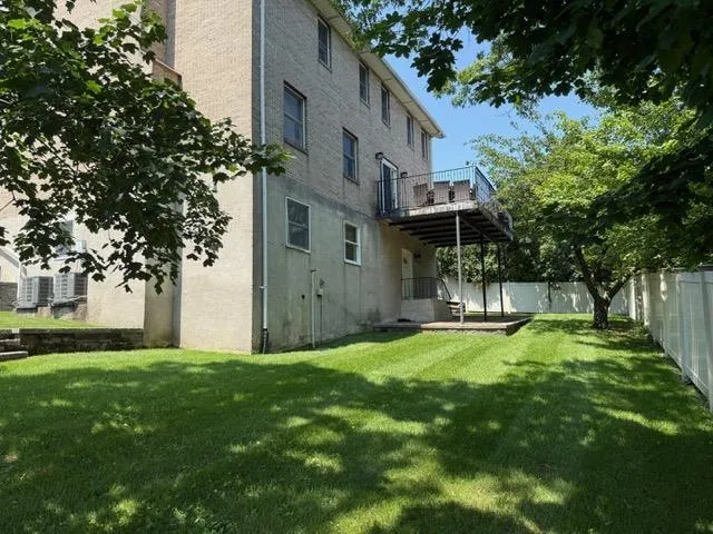 a view of a backyard with a small cabin