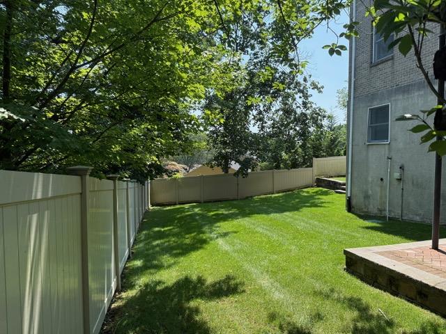 433 New Rochelle Road Bronxville, NY 10708 - Photo 40 of 41 a view of a backyard with a tree
