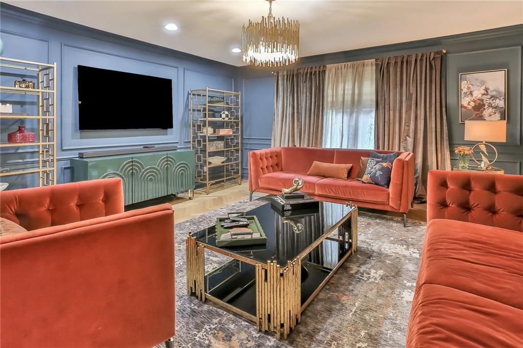 433 New Rochelle Road Bronxville, NY 10708 - Photo 6 of 41 a living room with furniture and a flat screen tv