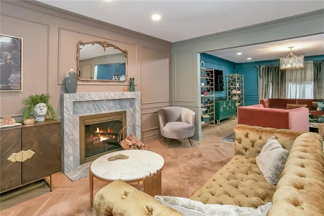 a living room with furniture and a fireplace