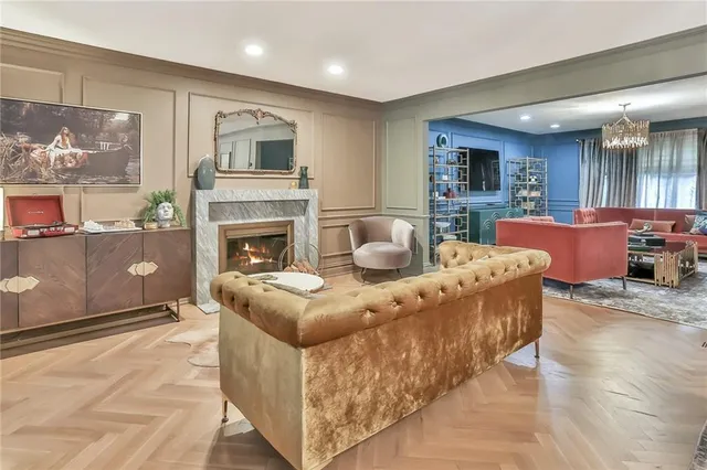 a living room with furniture and a fireplace