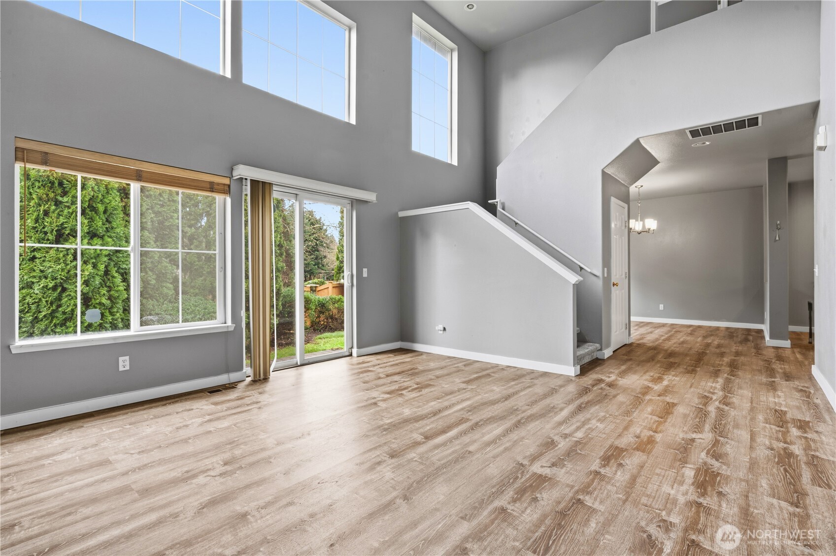 5624 South 233rd Street, Unit 41 Kent, WA 98032 - Photo 12 of 37 a view of an empty room with wooden floor and a window