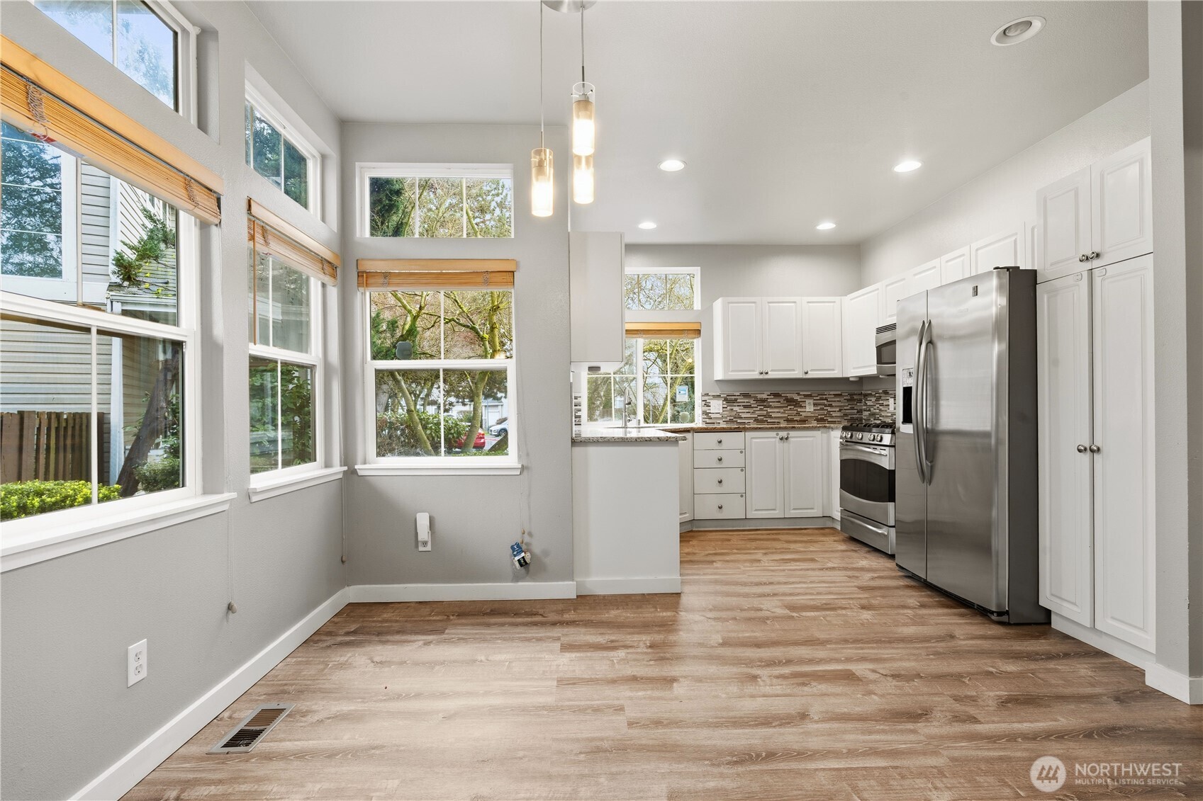 5624 South 233rd Street, Unit 41 Kent, WA 98032 - Photo 13 of 37 a view of a kitchen with a stove top oven a refrigerator and a window