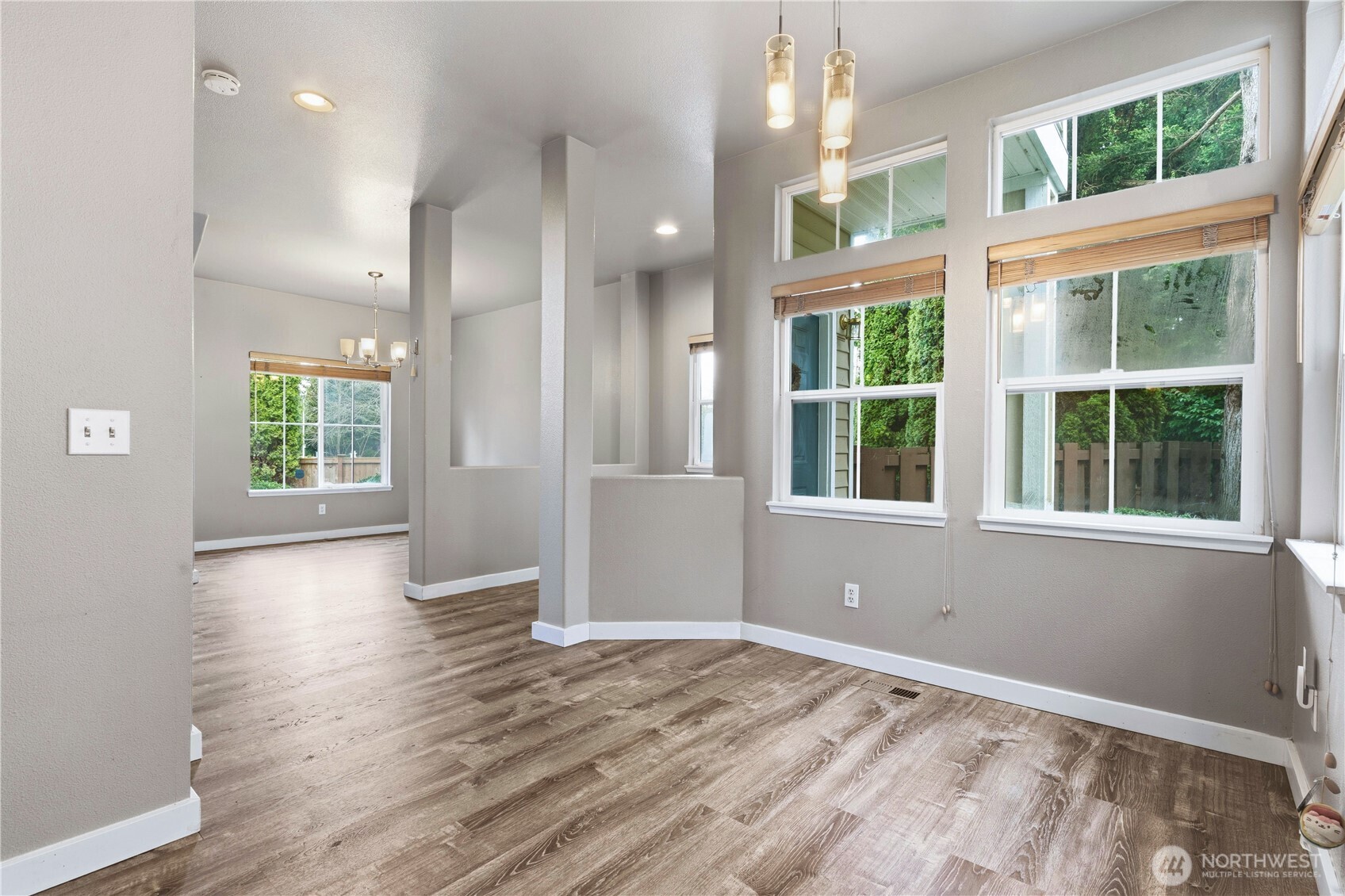 5624 South 233rd Street, Unit 41 Kent, WA 98032 - Photo 17 of 37 a view of an empty room with a window and wooden floor