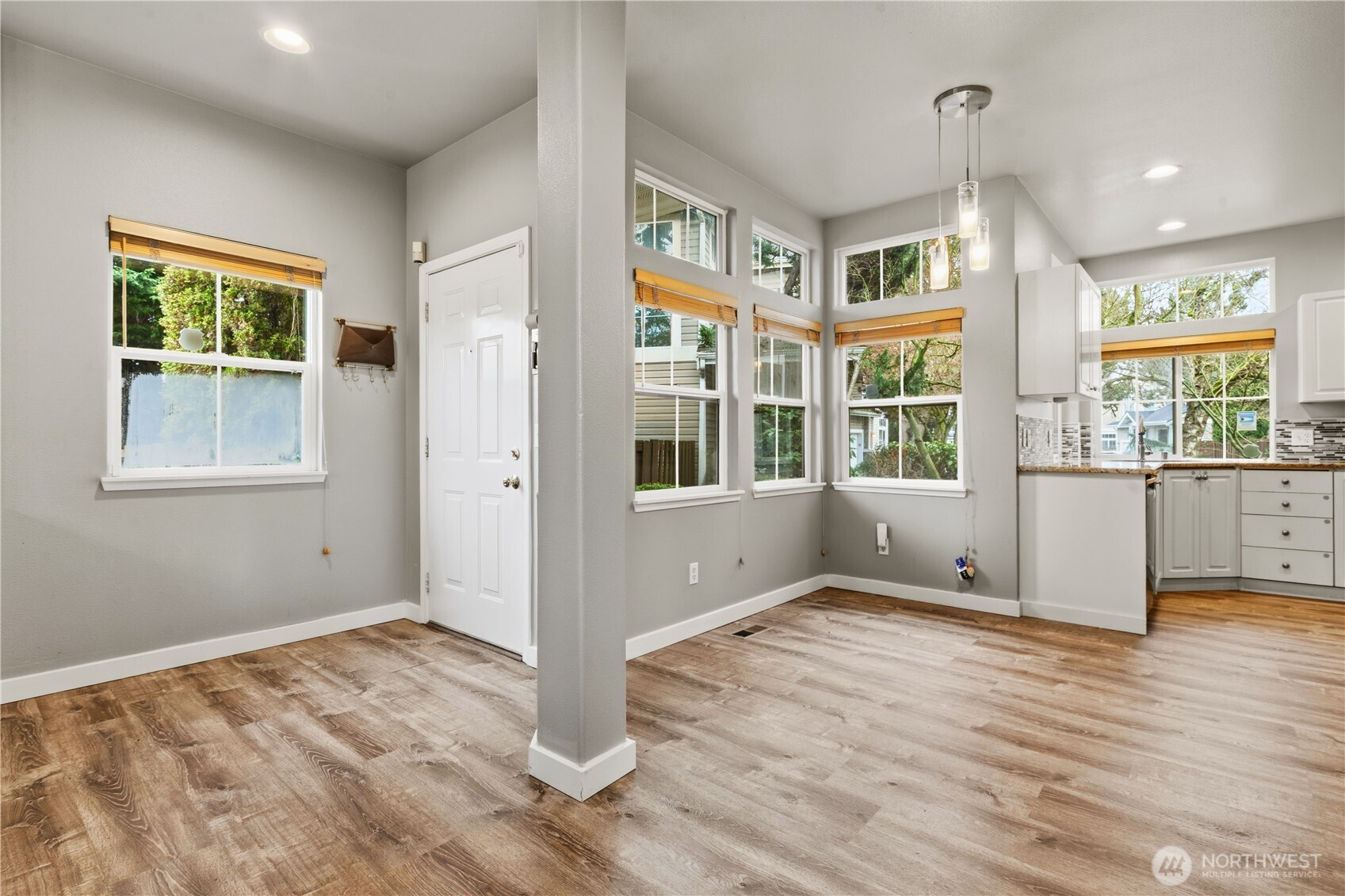 5624 South 233rd Street, Unit 41 Kent, WA 98032 - Photo 20 of 37 a view of an empty room with a window and wooden floor