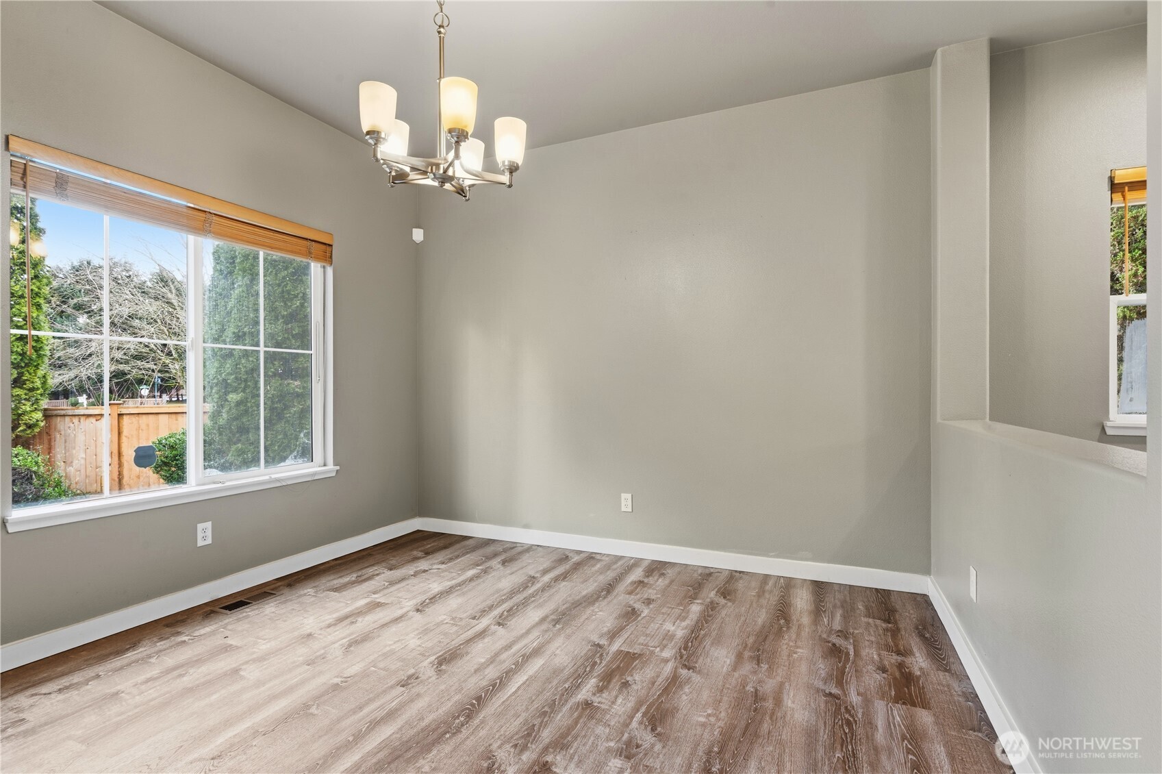 5624 South 233rd Street, Unit 41 Kent, WA 98032 - Photo 22 of 37 a view of empty room with wooden floor and fan