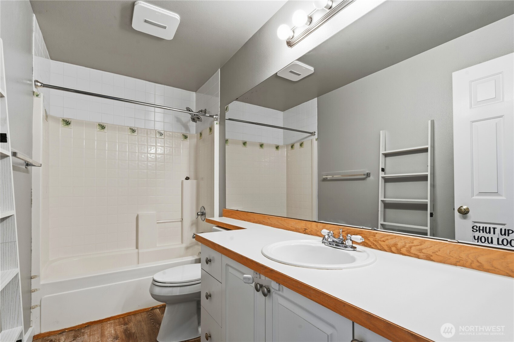 5624 South 233rd Street, Unit 41 Kent, WA 98032 - Photo 24 of 37 a bathroom with a sink a toilet a mirror and shower