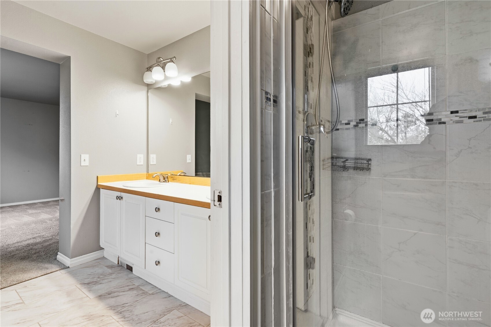 5624 South 233rd Street, Unit 41 Kent, WA 98032 - Photo 27 of 37 a bathroom with a double vanity sink mirror and shower