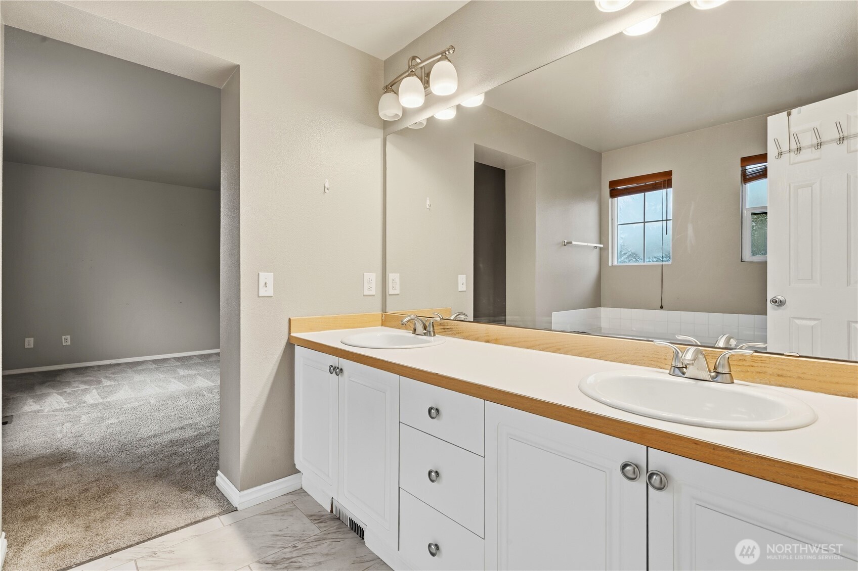 5624 South 233rd Street, Unit 41 Kent, WA 98032 - Photo 29 of 37 a bathroom with a sink and a mirror