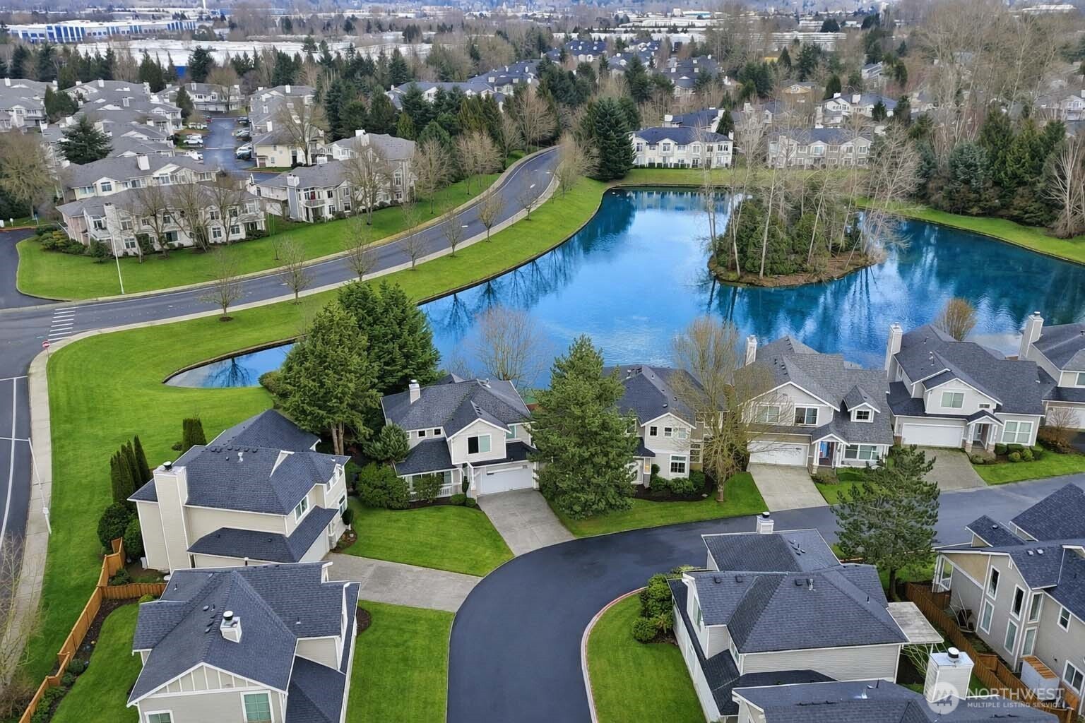 5624 South 233rd Street, Unit 41 Kent, WA 98032 - Photo 36 of 37 an aerial view of a house with a garden and lake view