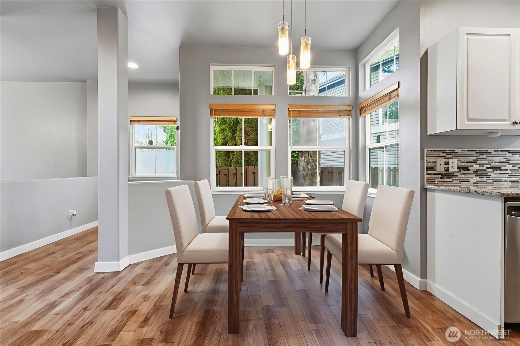 5624 South 233rd Street, Unit 41 Kent, WA 98032 - Photo 5 of 37 a view of a dining room with furniture a chandelier and wooden floor