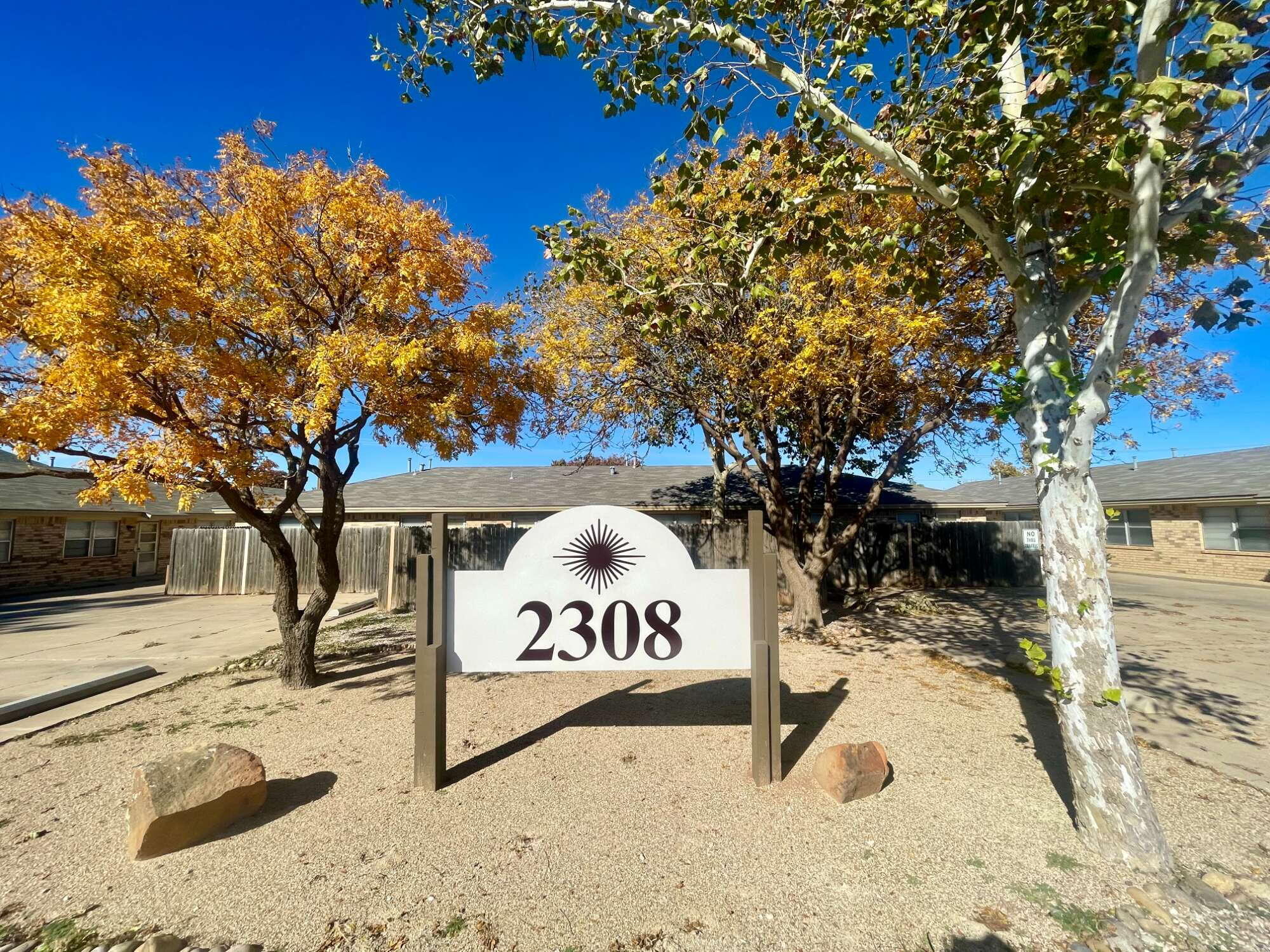 a view of outdoor space with signage and flags