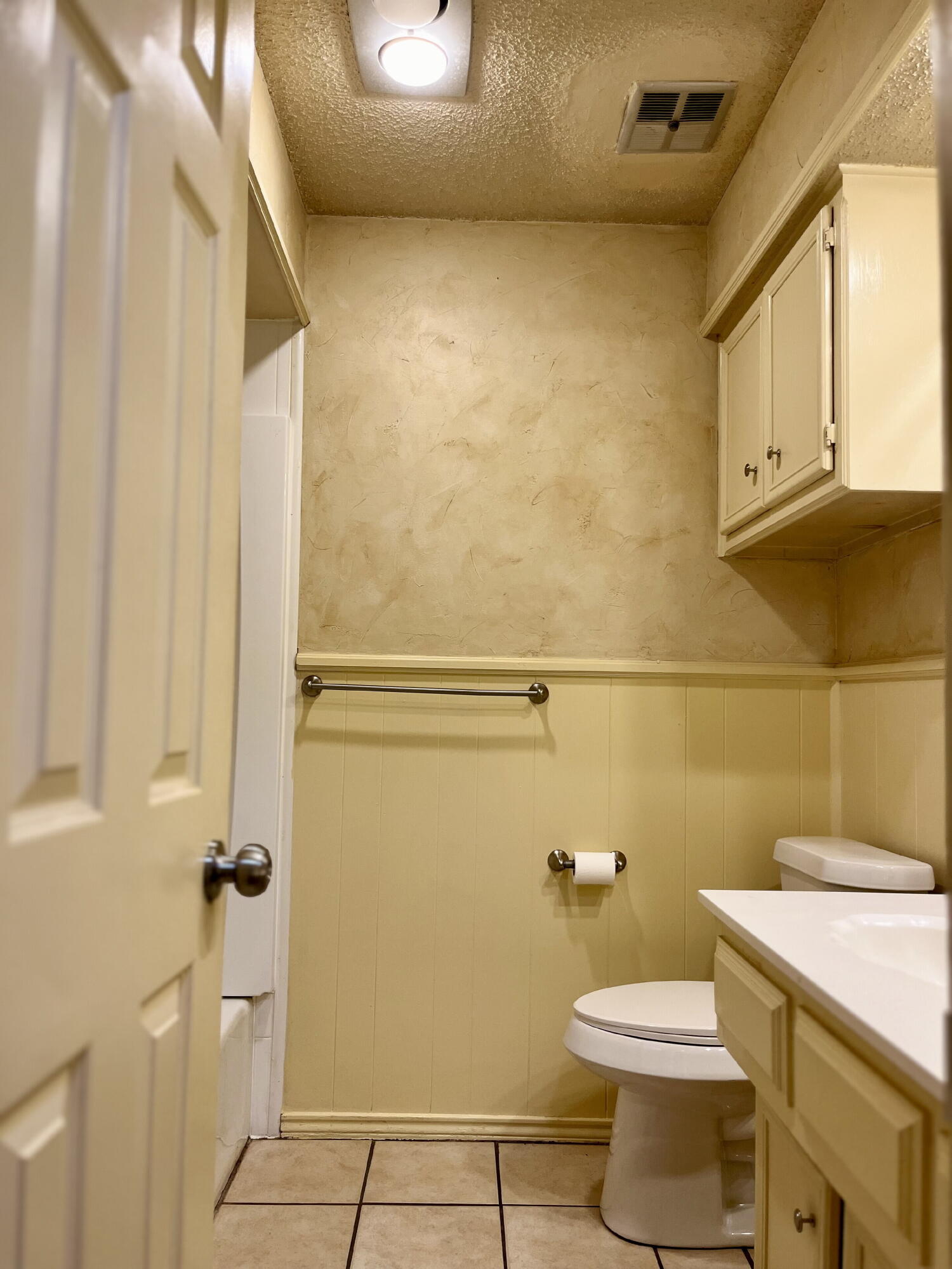 2308 74th Street, Unit B3 Lubbock, TX 79423 - Photo 12 of 18 a white toilet sitting next to a bathroom sink