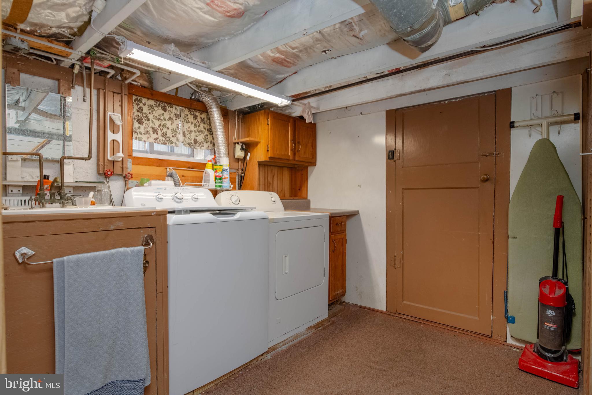 318 Lorraine Avenue Baltimore, MD 21221 - Photo 19 of 27 a utility room with dryer and washer