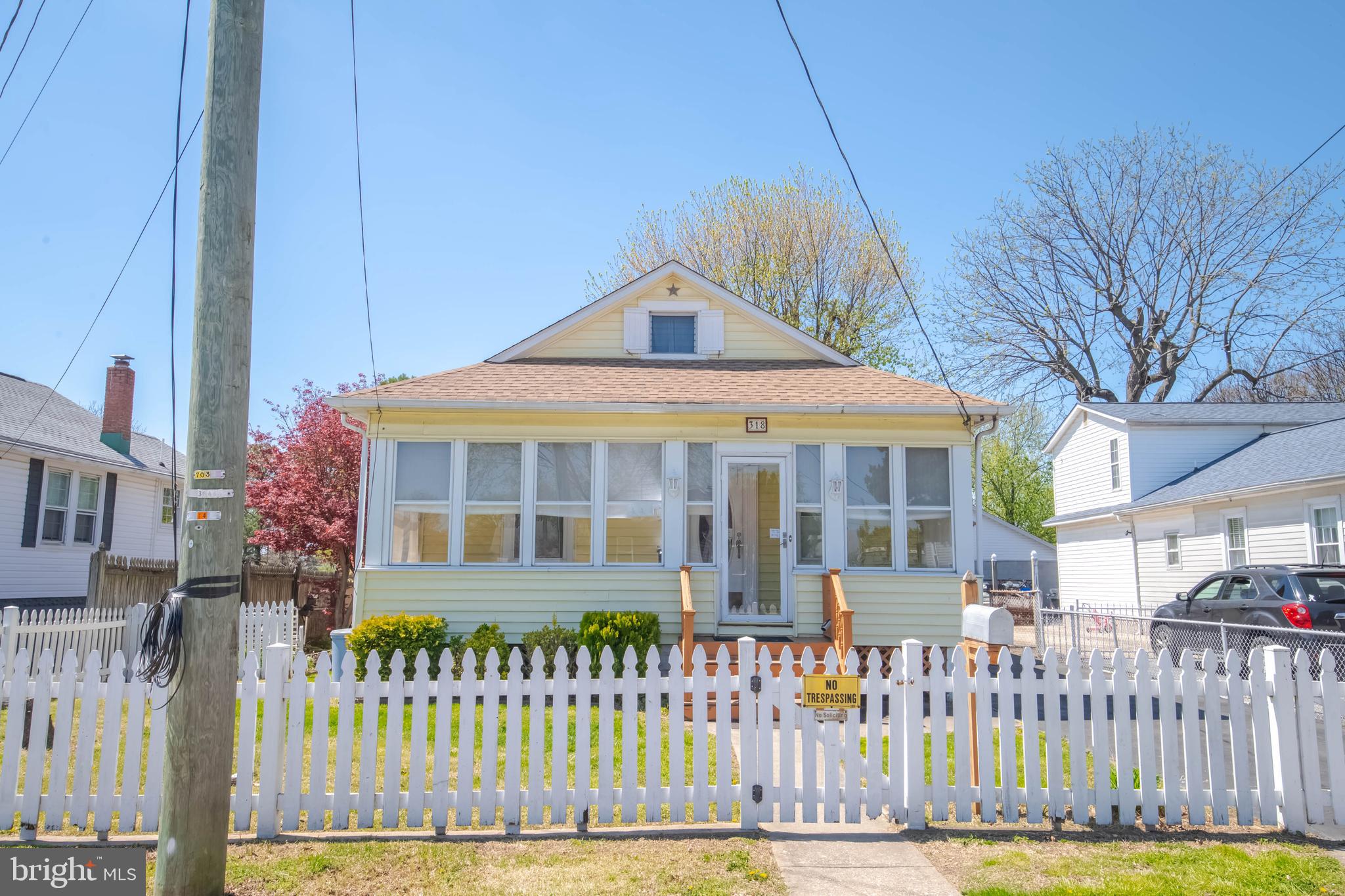318 Lorraine Avenue Baltimore, MD 21221 - Photo 2 of 27 a front view of a house with a fence