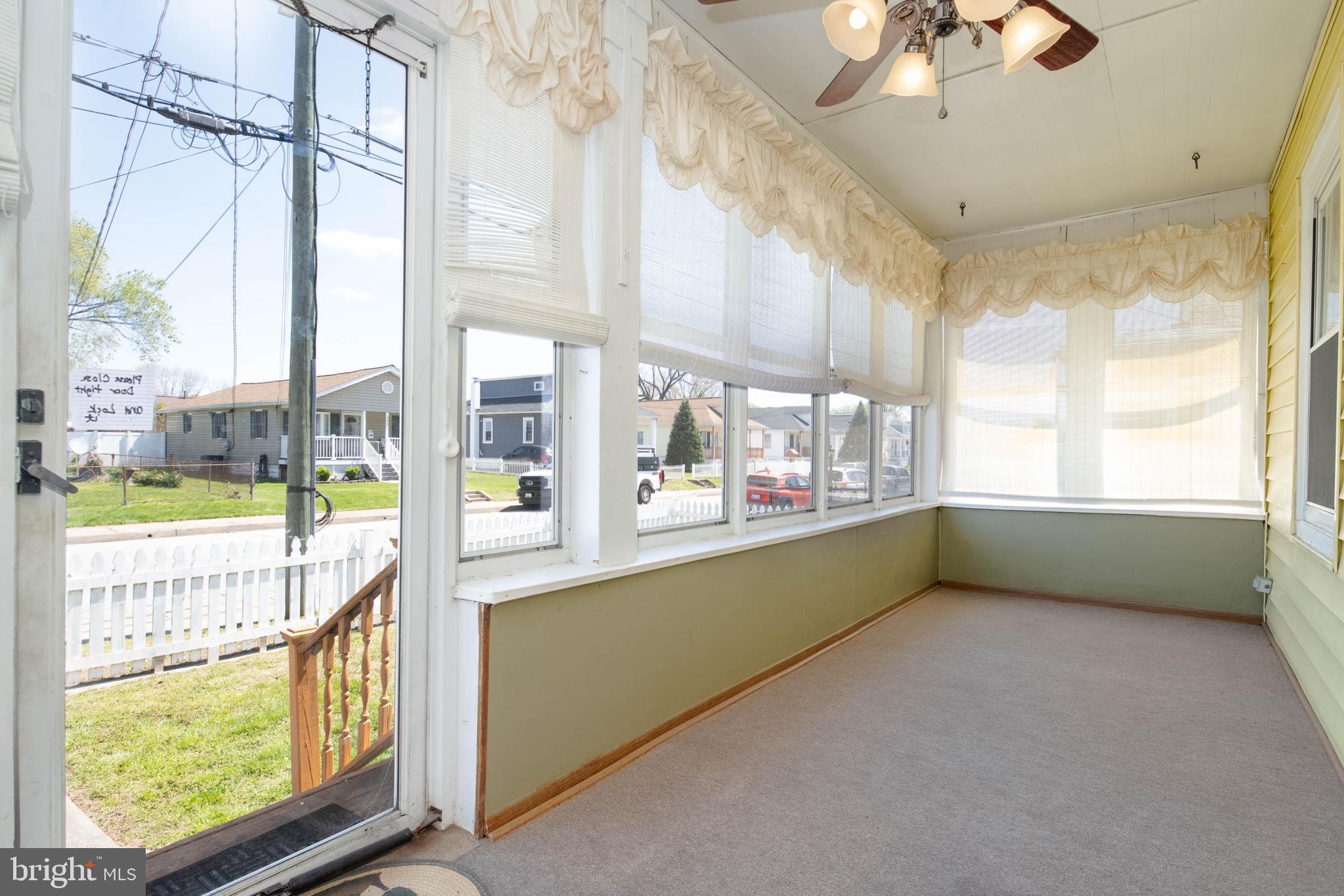 318 Lorraine Avenue Baltimore, MD 21221 - Photo 4 of 27 a view of an empty room with a window
