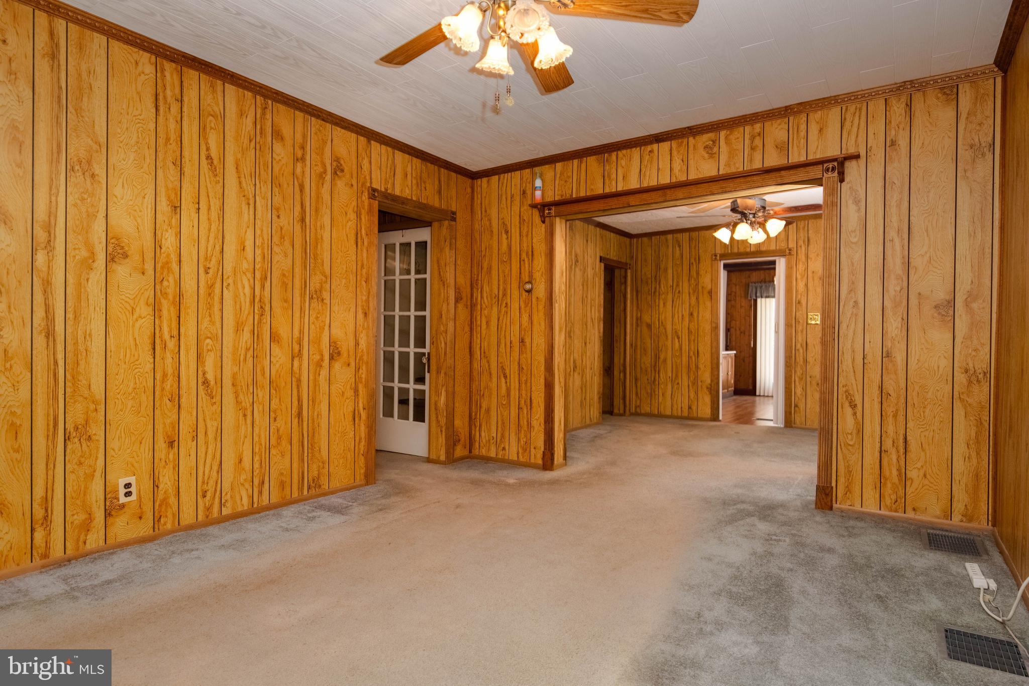 318 Lorraine Avenue Baltimore, MD 21221 - Photo 5 of 27 wooden floor in an empty room