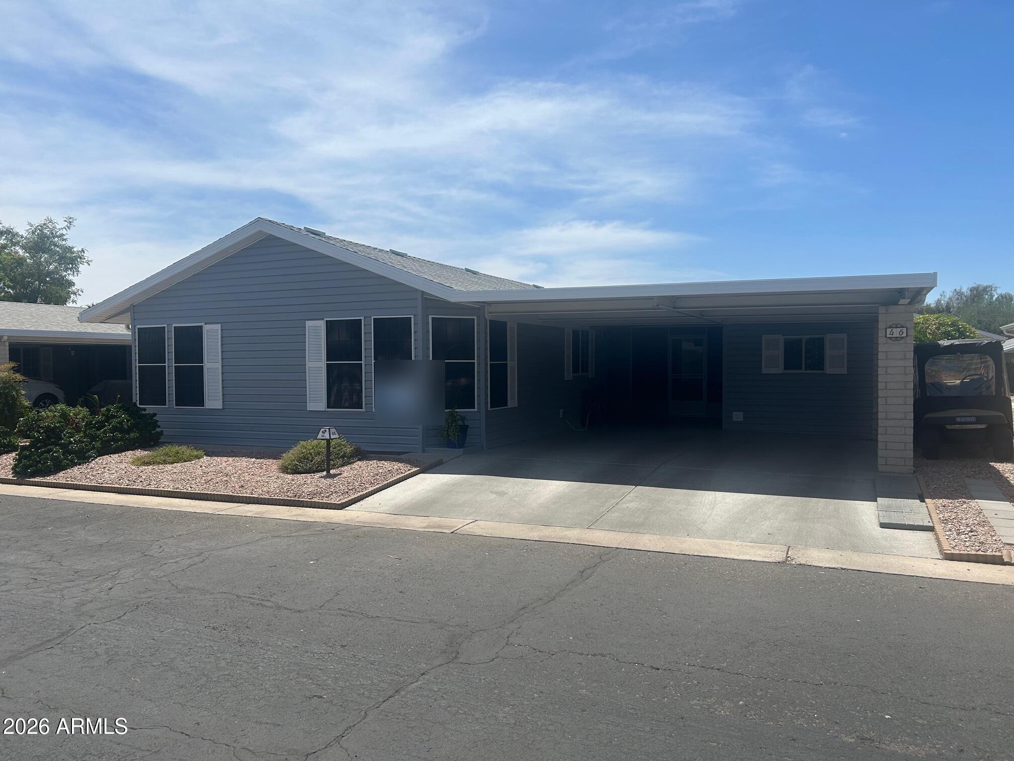 2550 South Ellsworth Road, Unit 46 Mesa, AZ 85209 - Photo 1 of 46 front view of house with a yard