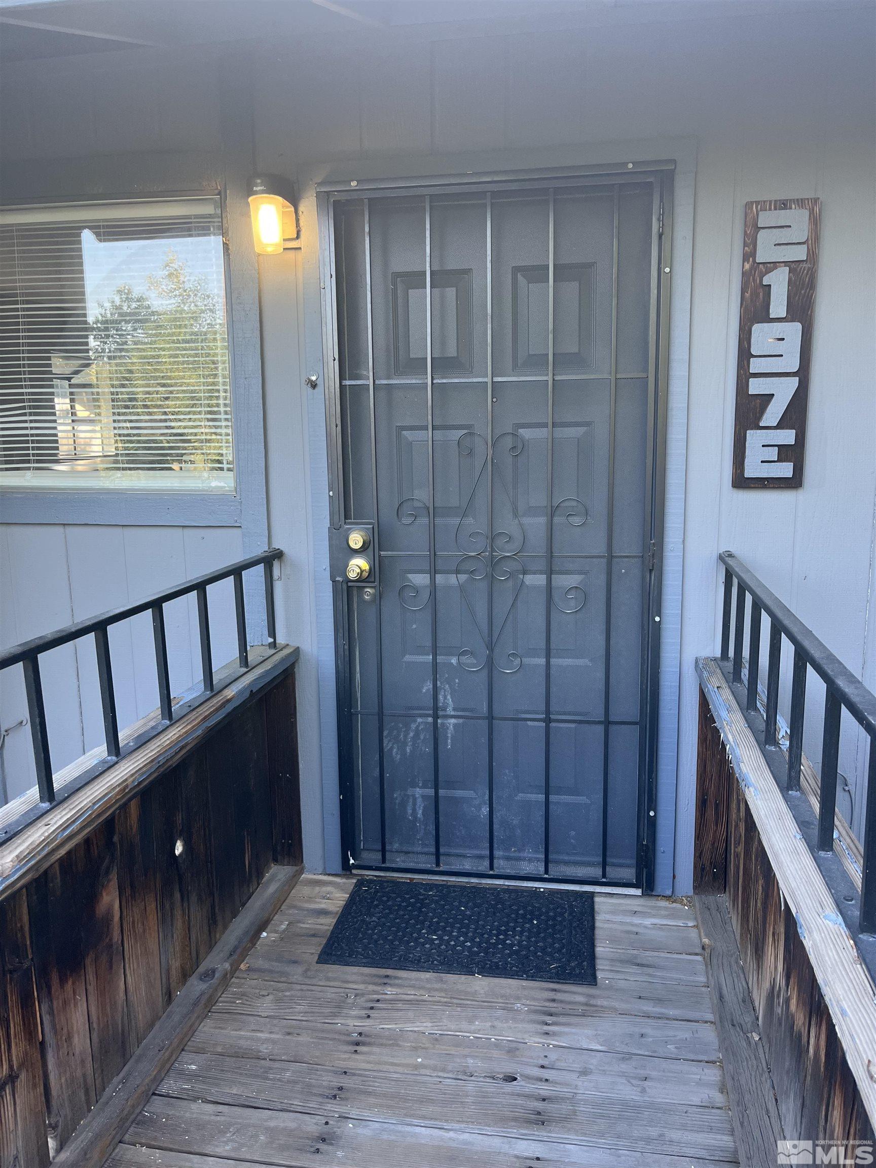 2197 Kietzke Lane, Unit E Reno, NV 89502 - Photo 1 of 7 a view of entryway with wooden floor and stairs